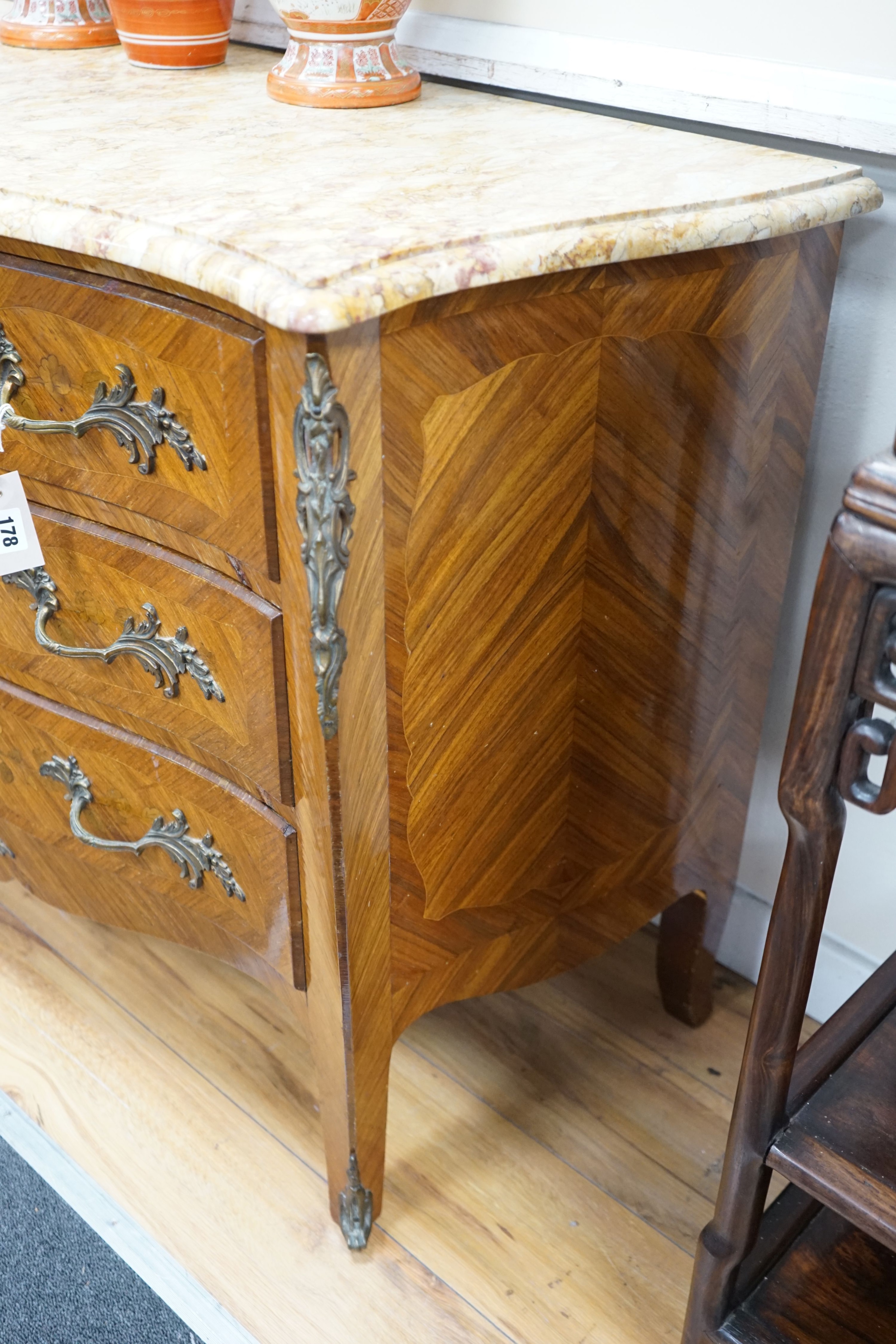 A Louis XV style marquetry inlaid kingwood serpentine marble topped bombe commode, width 120cm, depth 49cm, height 82cm